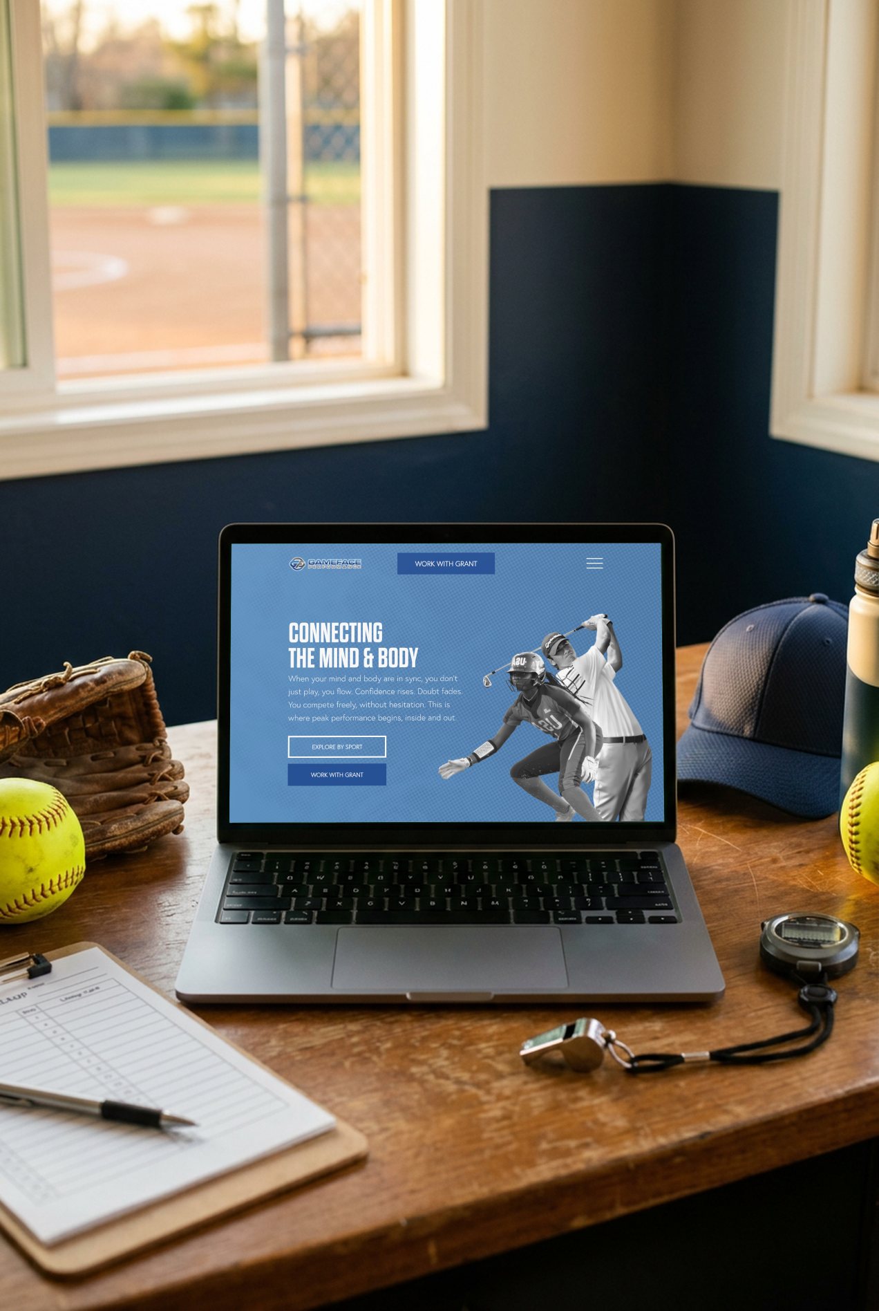 Game Face Performance's homepage on a laptop, on a softball coach's desk